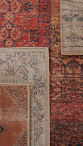 Layer rugs for depth